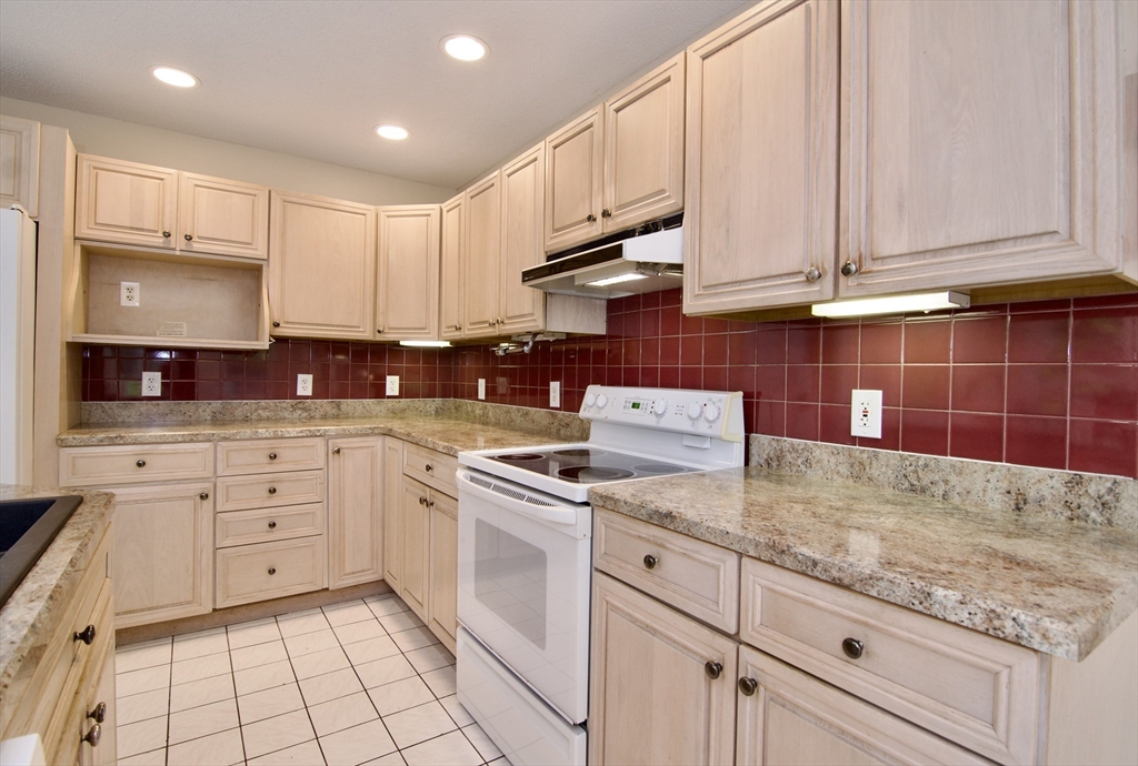 97 Monson Road Brimfield, MA 01010 - Photo 23 of 42 a kitchen with cabinets appliances and a sink