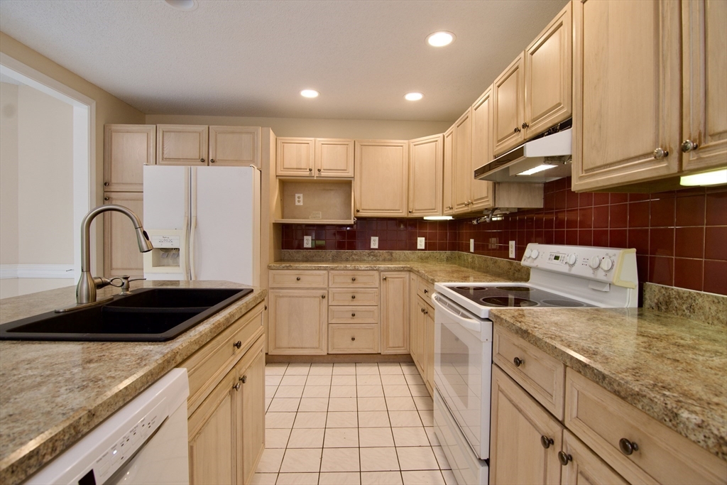 97 Monson Road Brimfield, MA 01010 - Photo 24 of 42 a kitchen with a sink stove and cabinets