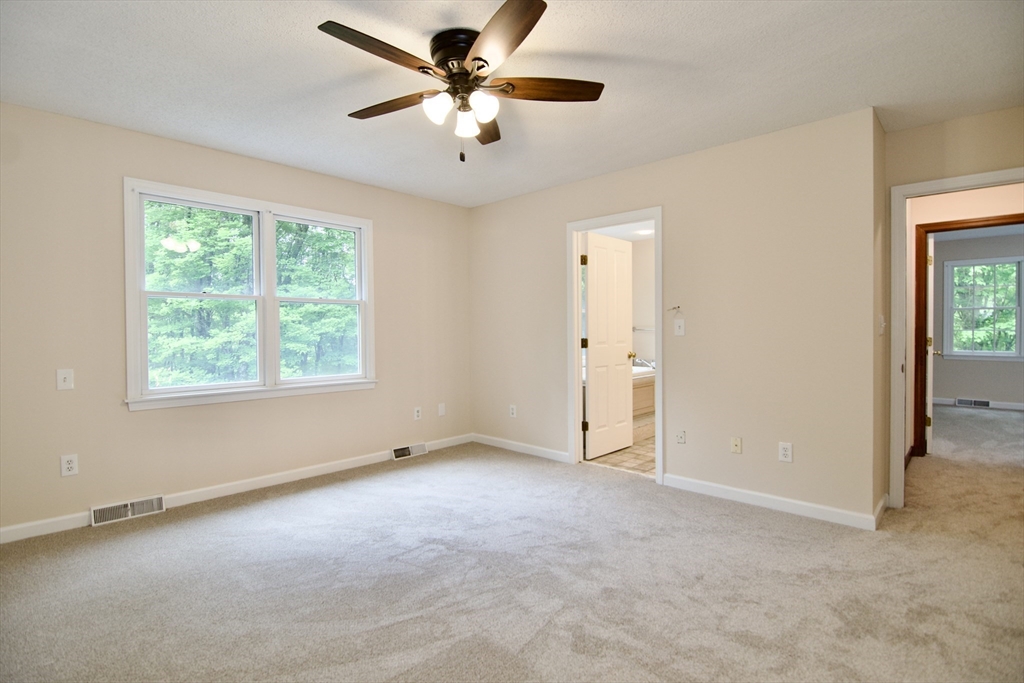 97 Monson Road Brimfield, MA 01010 - Photo 33 of 42 an empty room with a ceiling fan and a window