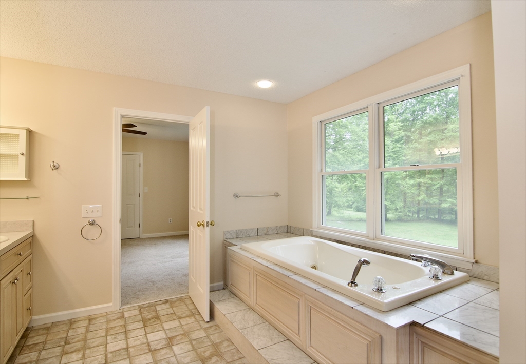 97 Monson Road Brimfield, MA 01010 - Photo 35 of 42 a bathroom with a tub a sink and a window