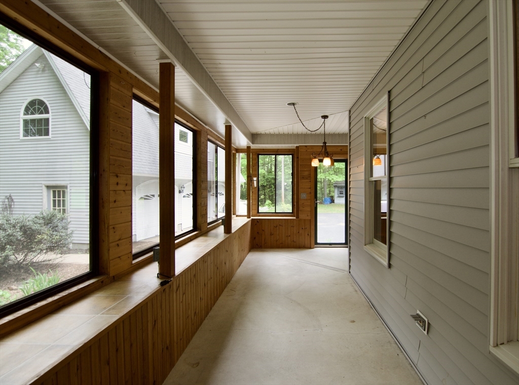 97 Monson Road Brimfield, MA 01010 - Photo 8 of 42 a view of hallway with large windows