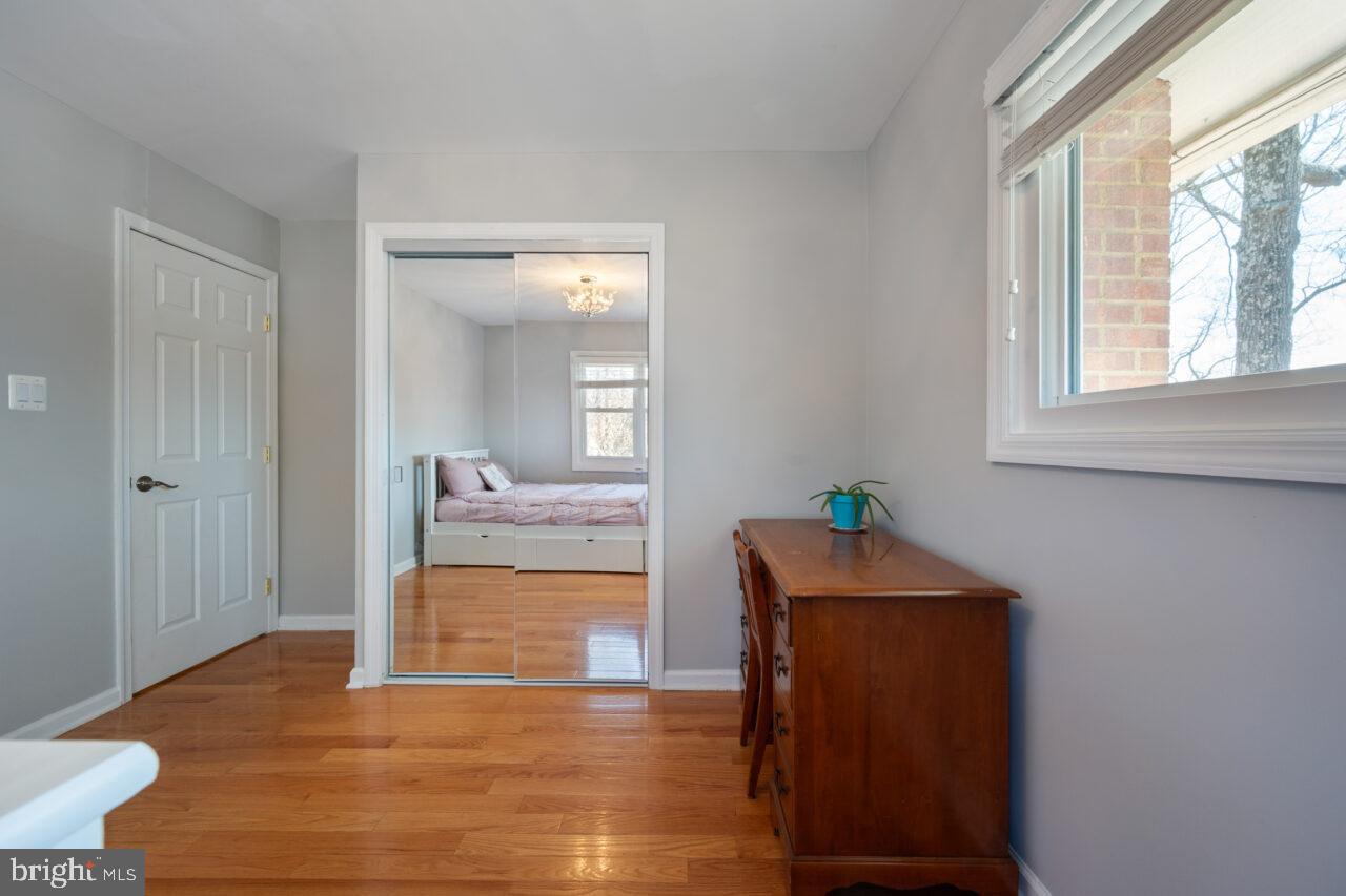 2405 Cedar Lane Vienna, VA 22180 - Photo 20 of 56 a room with wooden floor and furniture