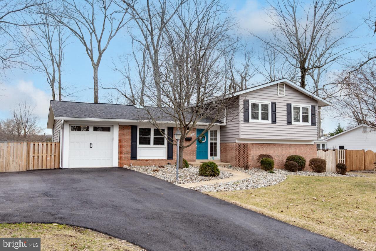 2405 Cedar Lane Vienna, VA 22180 - Photo 2 of 56 a front view of a house with parking space