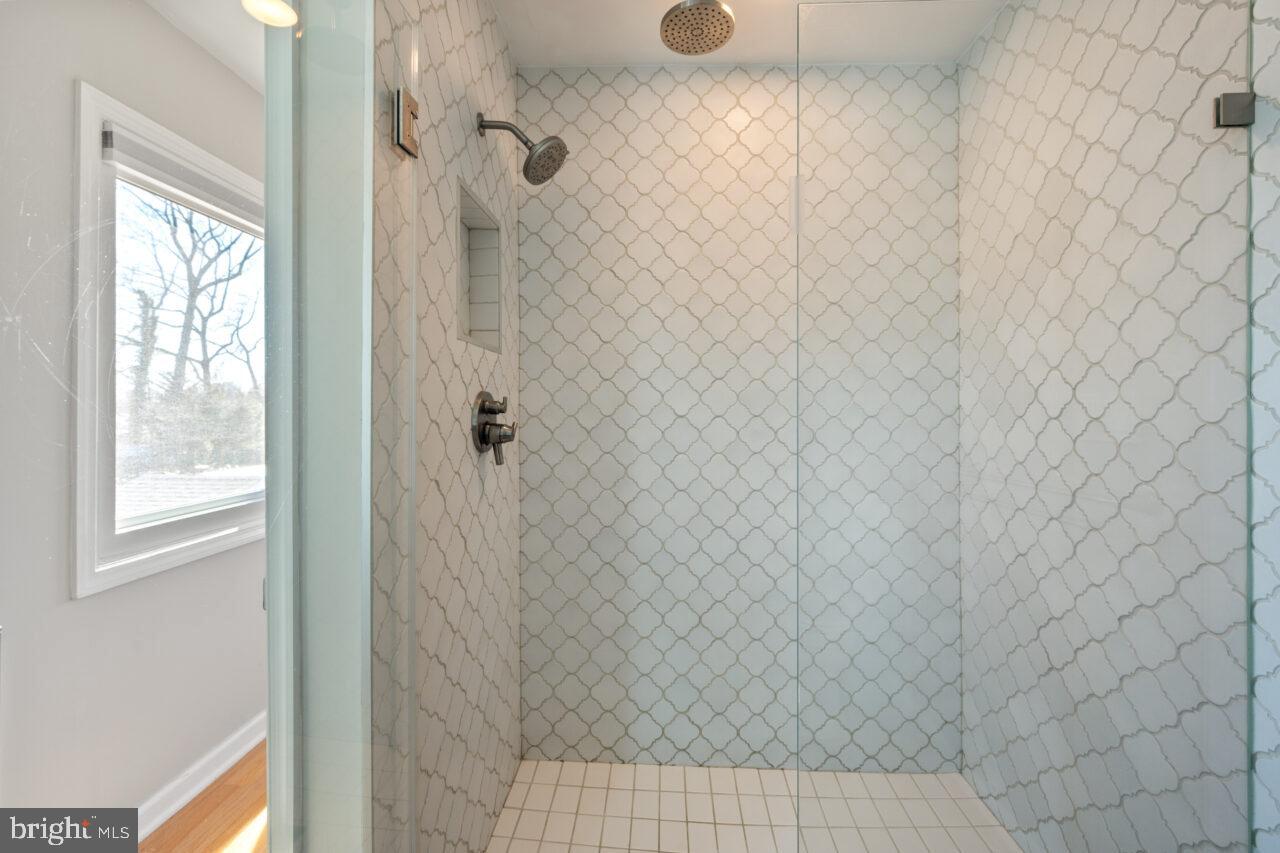 2405 Cedar Lane Vienna, VA 22180 - Photo 32 of 56 a bathroom with a shower