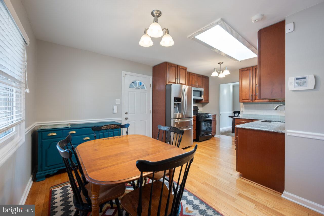 2405 Cedar Lane Vienna, VA 22180 - Photo 37 of 56 a view of a dining room with furniture and wooden floor