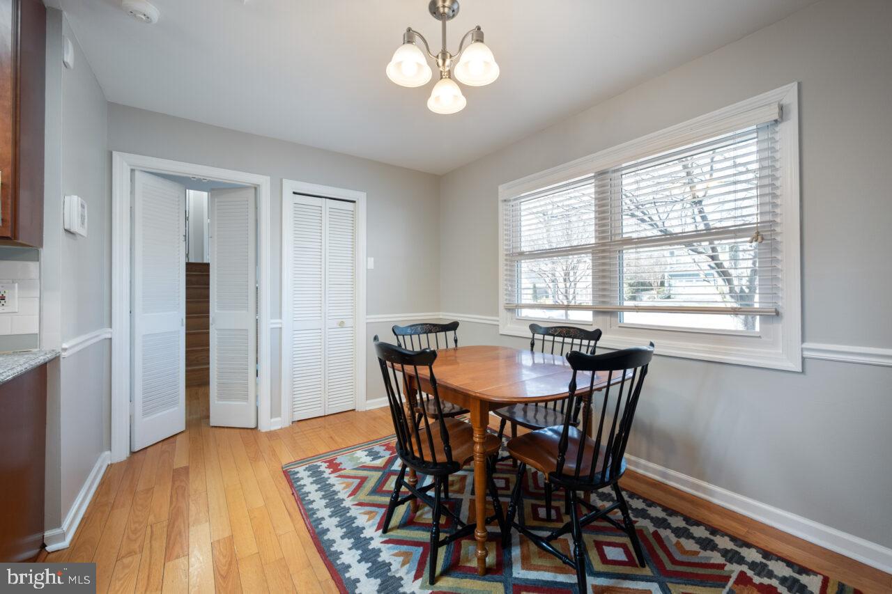2405 Cedar Lane Vienna, VA 22180 - Photo 38 of 56 a view of a dining room with furniture and a chandelier