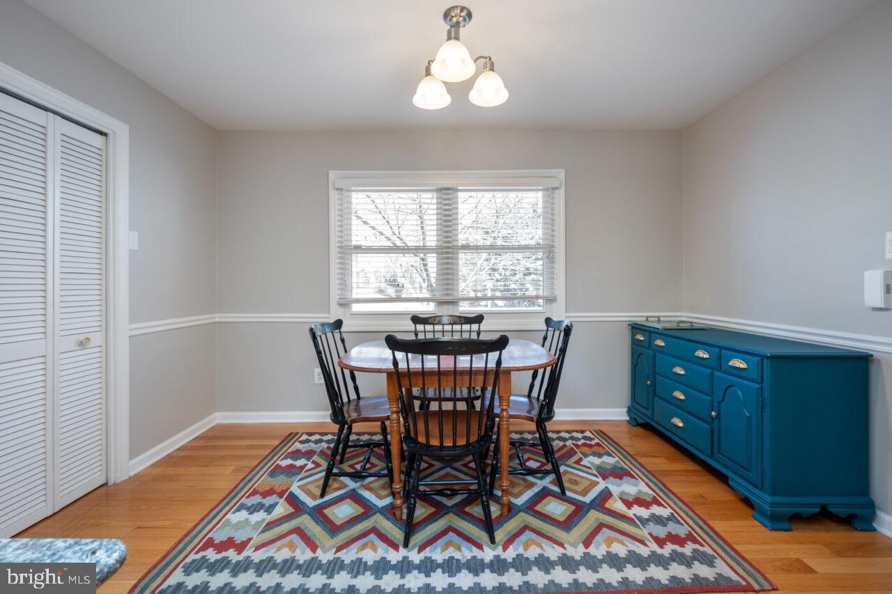 2405 Cedar Lane Vienna, VA 22180 - Photo 39 of 56 a view of a dining room with furniture window and wooden floor