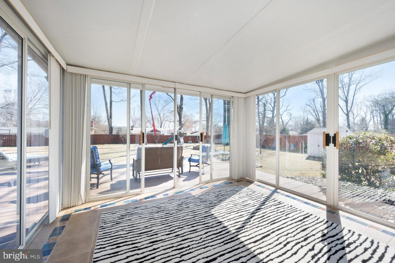 2405 Cedar Lane Vienna, VA 22180 - Photo 44 of 56 a bedroom with furniture and large windows