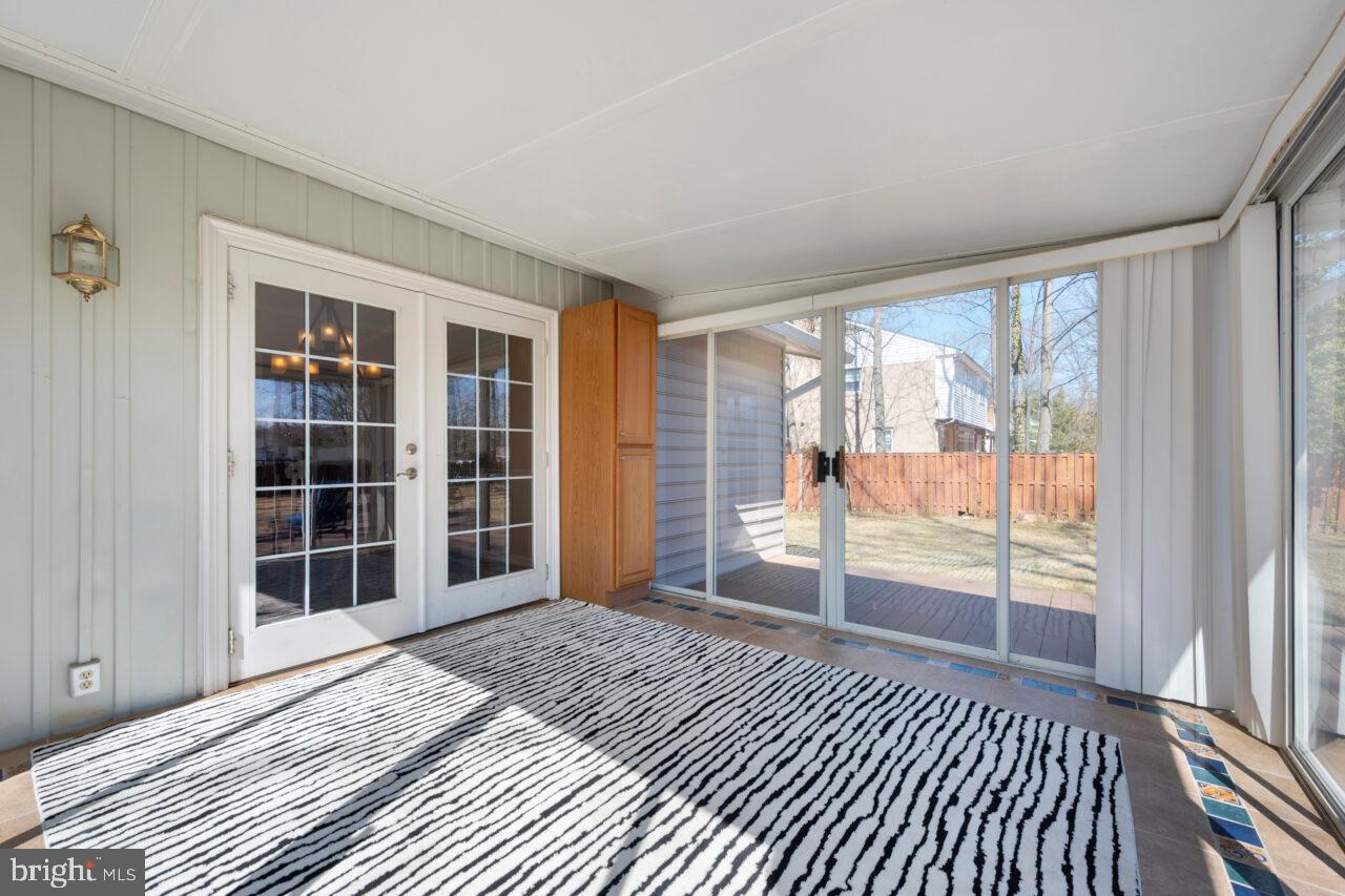 2405 Cedar Lane Vienna, VA 22180 - Photo 45 of 56 a view of a room with wooden floor and windows
