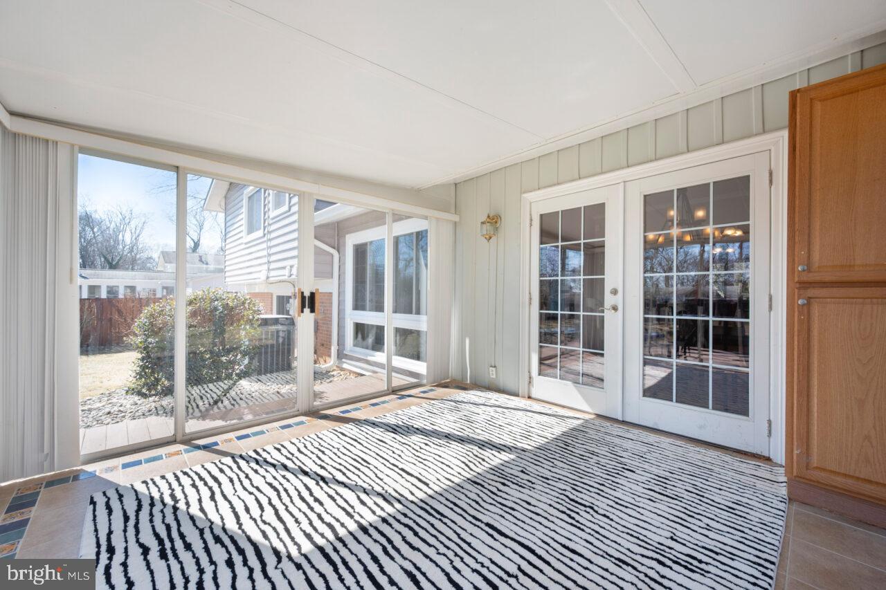 2405 Cedar Lane Vienna, VA 22180 - Photo 47 of 56 a bedroom with a bed and wooden floor