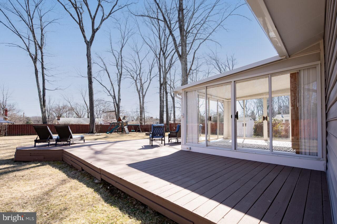 2405 Cedar Lane Vienna, VA 22180 - Photo 54 of 56 a view of a patio with wooden floor and iron fence