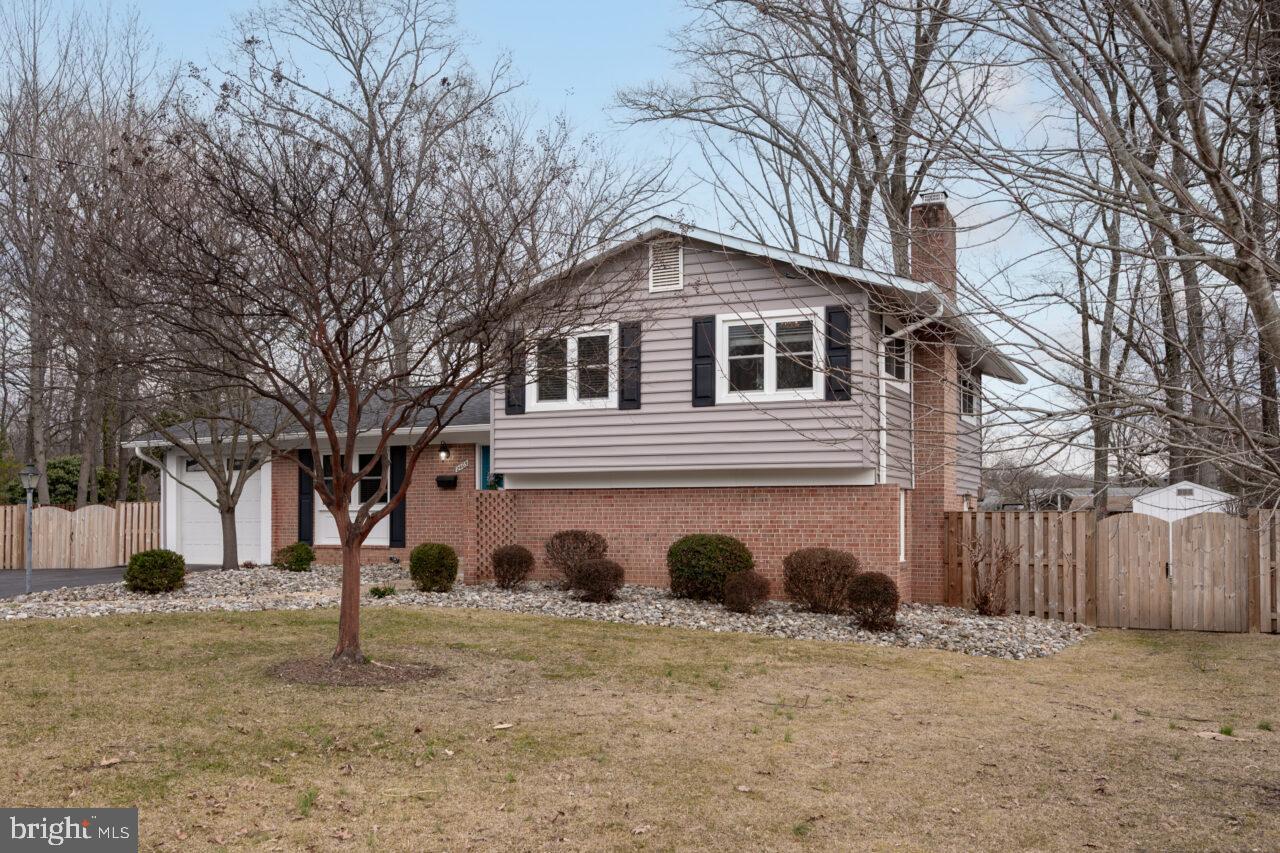 2405 Cedar Lane Vienna, VA 22180 - Photo 56 of 56 a front view of a house with a yard