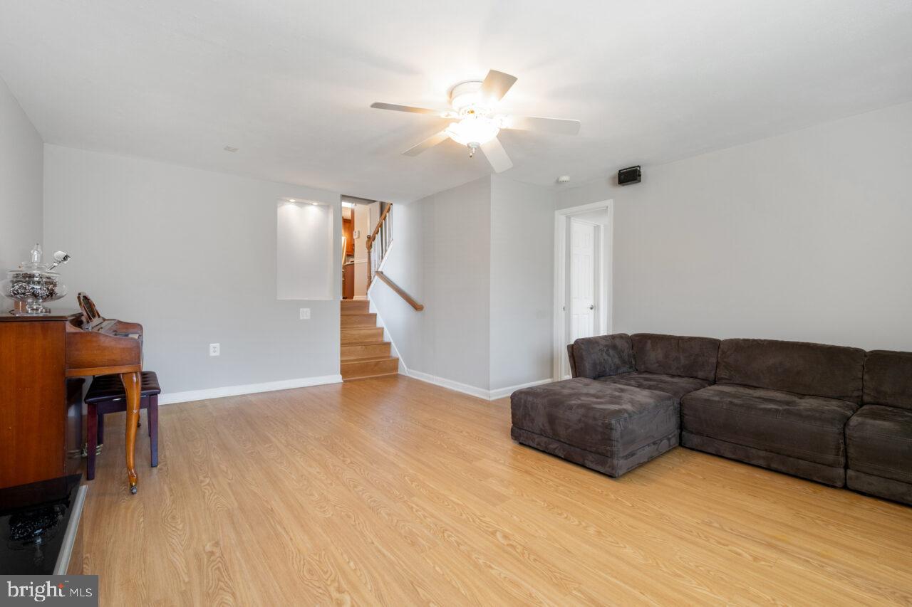 2405 Cedar Lane Vienna, VA 22180 - Photo 8 of 56 a living room with furniture and a chandelier