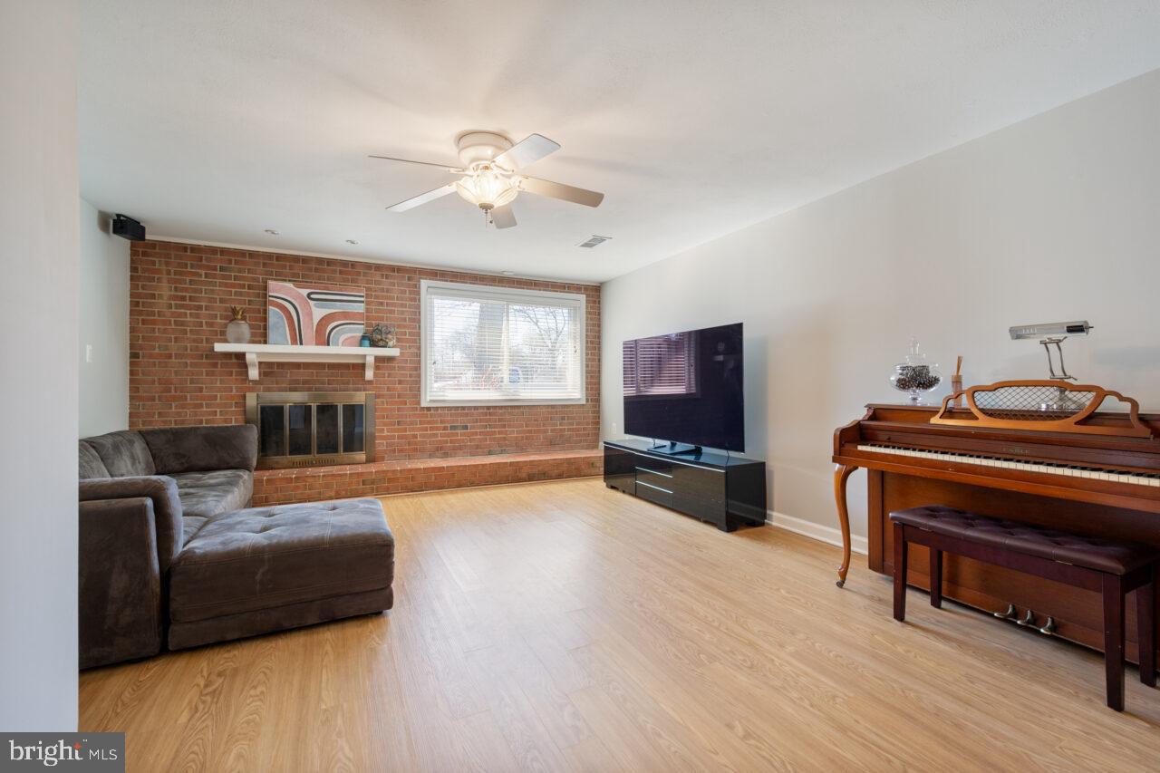 2405 Cedar Lane Vienna, VA 22180 - Photo 10 of 56 a living room with furniture and a flat screen tv