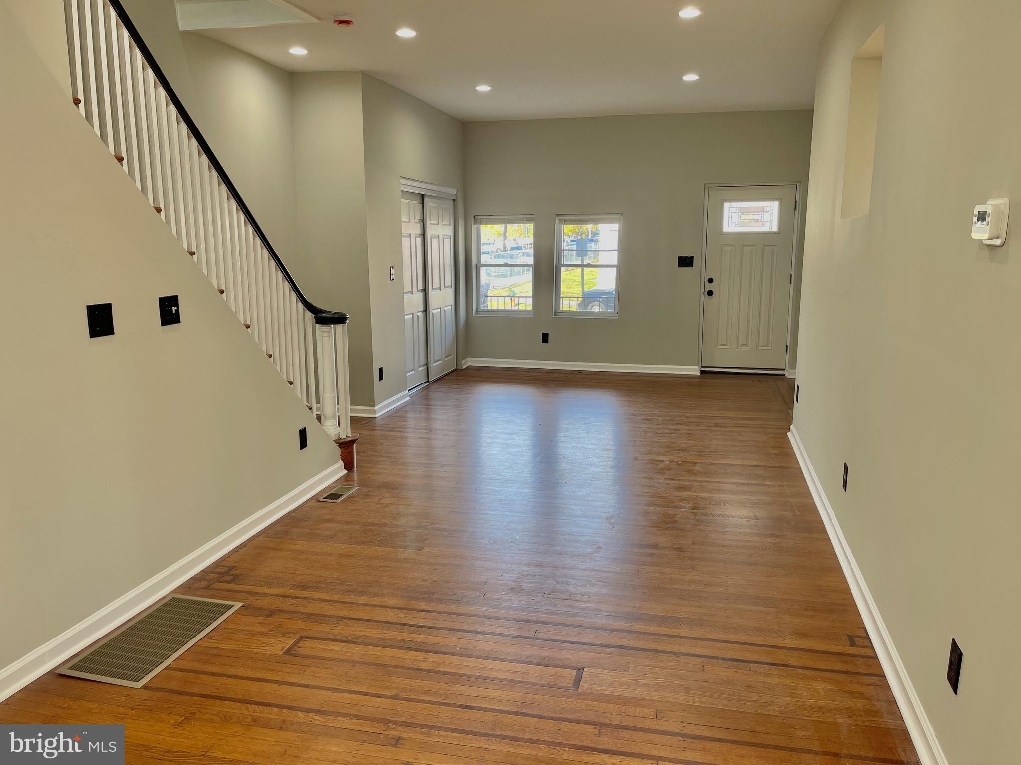 320 West Tabor Road Philadelphia, PA 19120 - Photo 8 of 33 a view of an empty room with wooden floor and a window