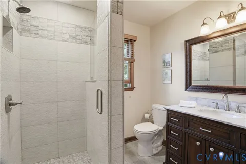 a spacious bathroom with a double vanity sink and a mirror