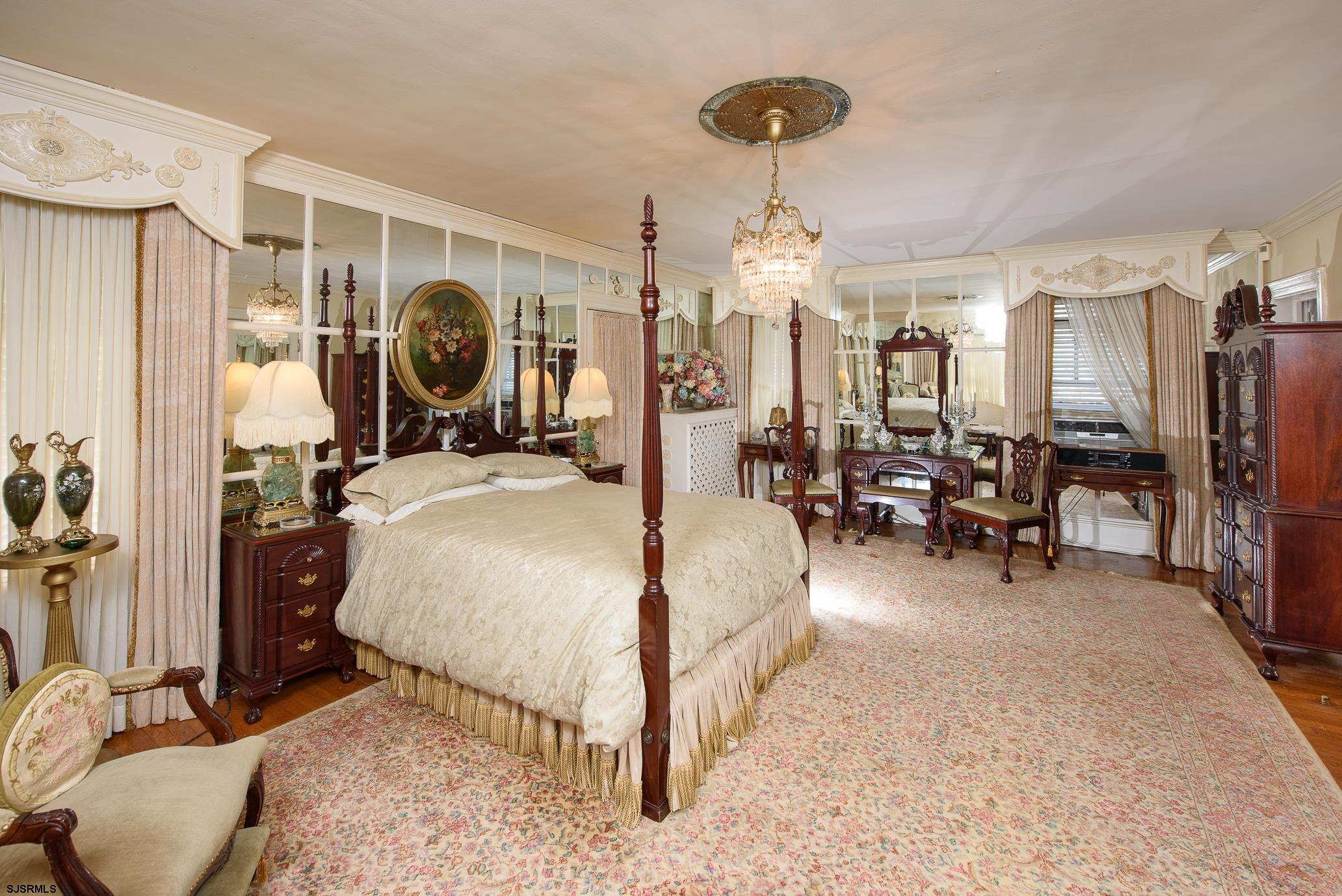 1707 Shore Road Northfield, NJ 08225 - Photo 34 of 46 a bed room with a bed and a chair