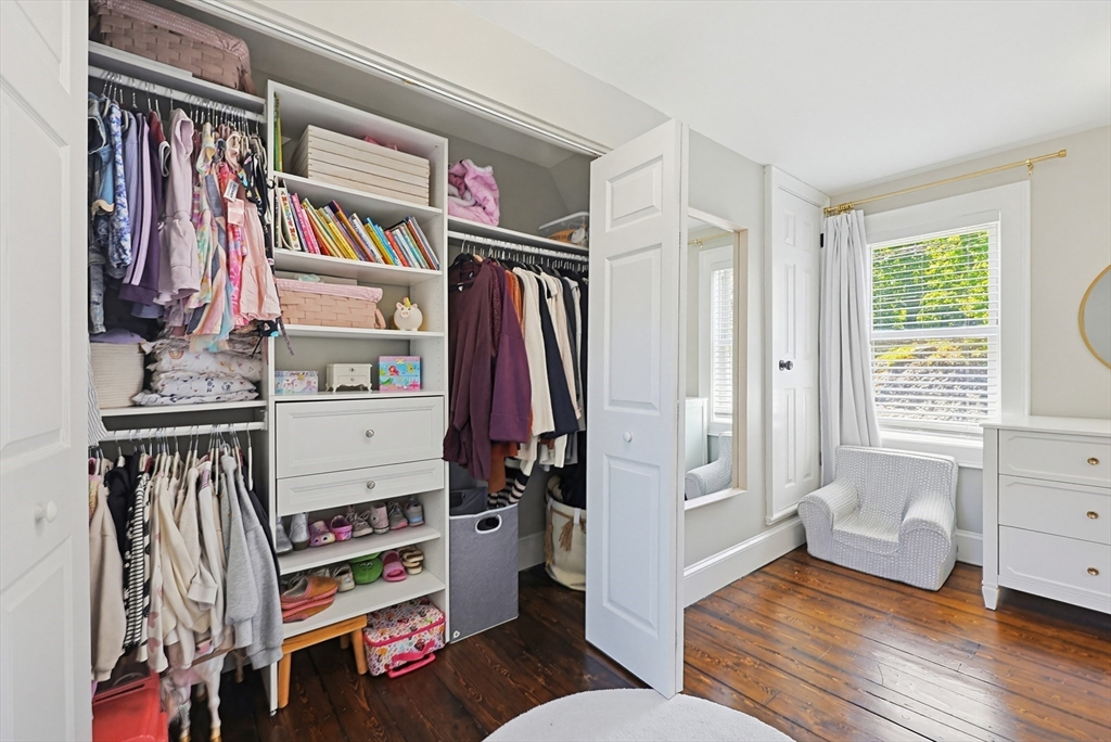 345 Sherman Street Canton, MA 02021 - Photo 26 of 42 a view of walk in closet with clothes and shoes