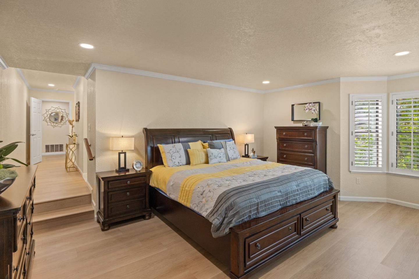 2896 Ransford Avenue Pacific Grove, CA 93950 - Photo 13 of 28 a bedroom with a bed and dresser with mirror