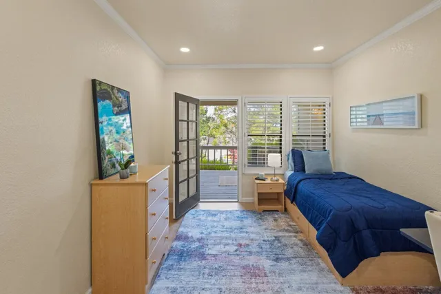 a bedroom with furniture and a window