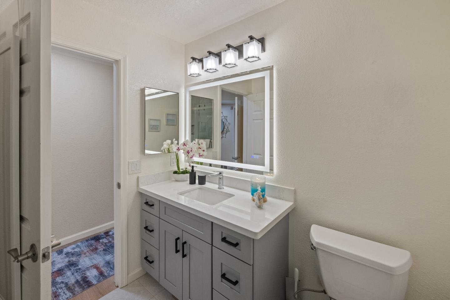 2896 Ransford Avenue Pacific Grove, CA 93950 - Photo 22 of 28 a bathroom with a toilet sink and mirror