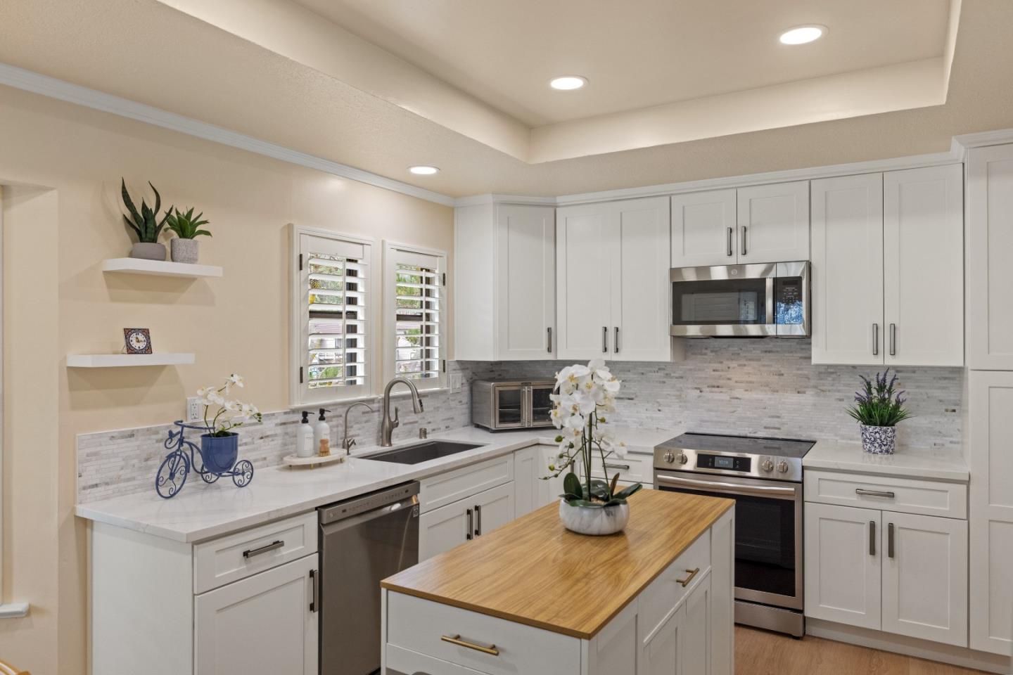 2896 Ransford Avenue Pacific Grove, CA 93950 - Photo 6 of 28 a kitchen with a sink stove and cabinets