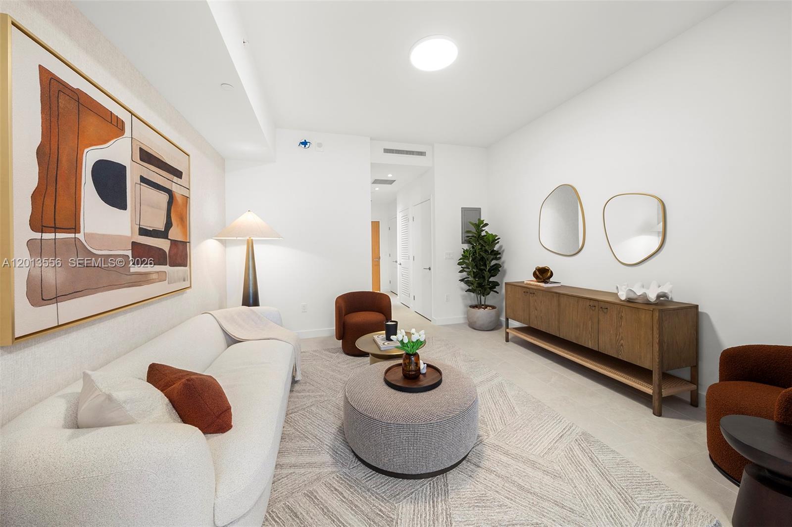 500 Alton Road, Unit 502 Miami Beach, FL 33139 - Photo 3 of 11 a living room with furniture rug and window