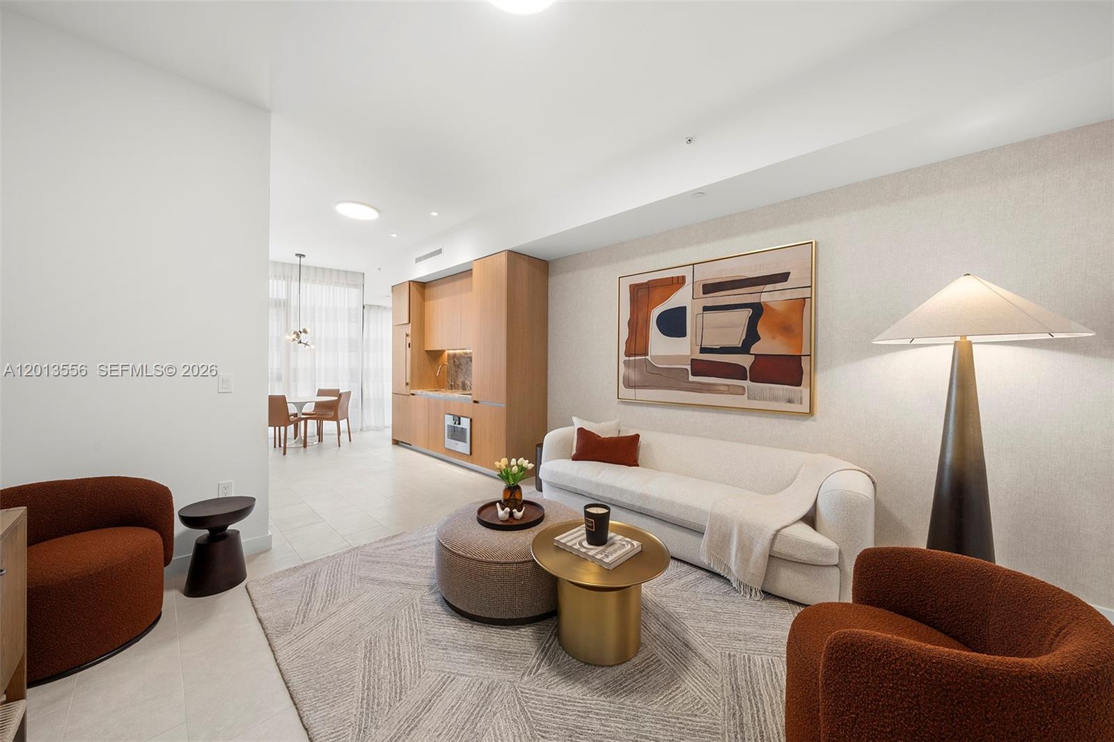500 Alton Road, Unit 502 Miami Beach, FL 33139 - Photo 5 of 11 a living room with furniture a couch and a lamp