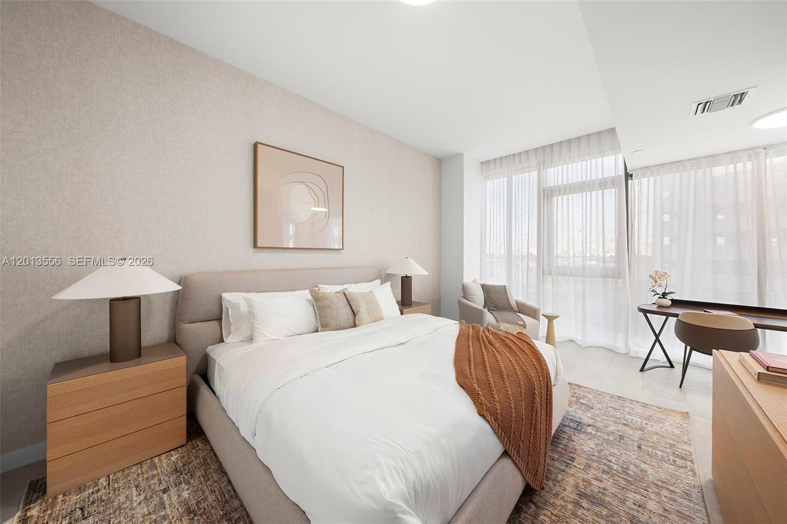 500 Alton Road, Unit 502 Miami Beach, FL 33139 - Photo 8 of 11 a bed room with a bed and a chair