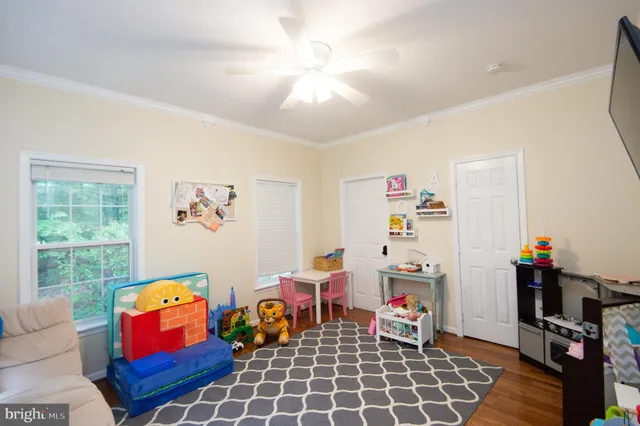 a living room with lots of furniture and a window