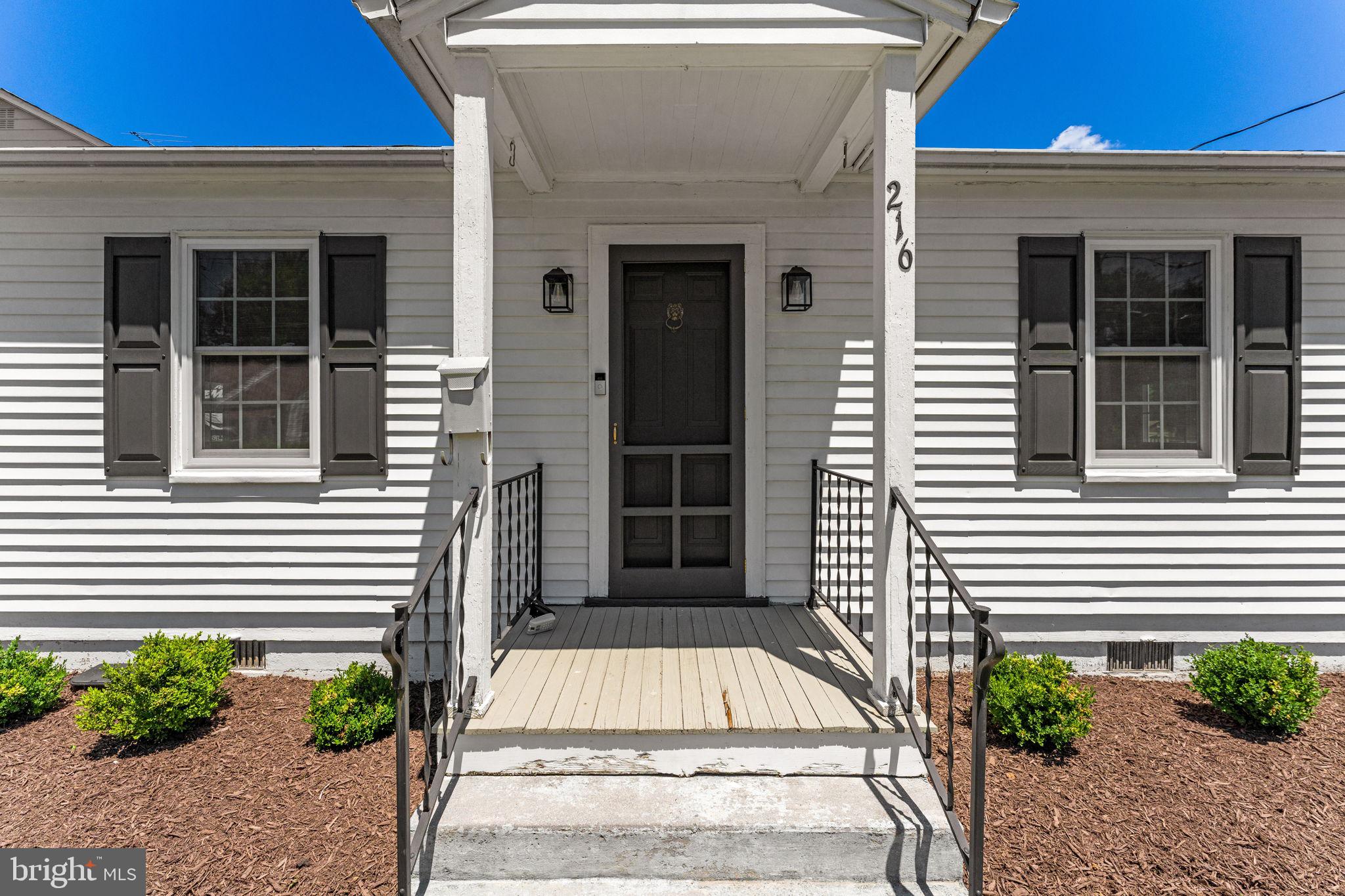 216 Walnut Street Berryville, VA 22611 - Photo 3 of 36 a view of a house with a door and a window