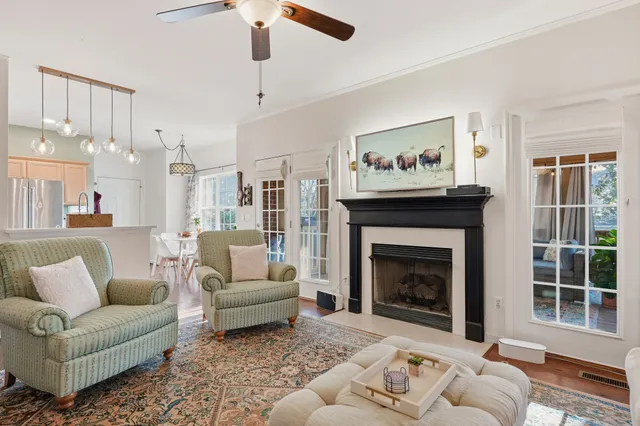 a living room with furniture and a fireplace