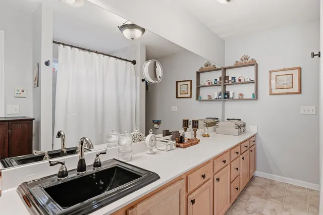 a bathroom with a sink and a mirror