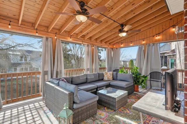a living room with furniture a wooden floor