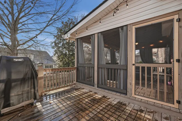 a view of a brick house with a large window