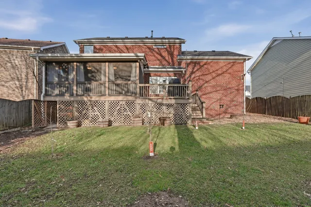 a front view of house with a garden