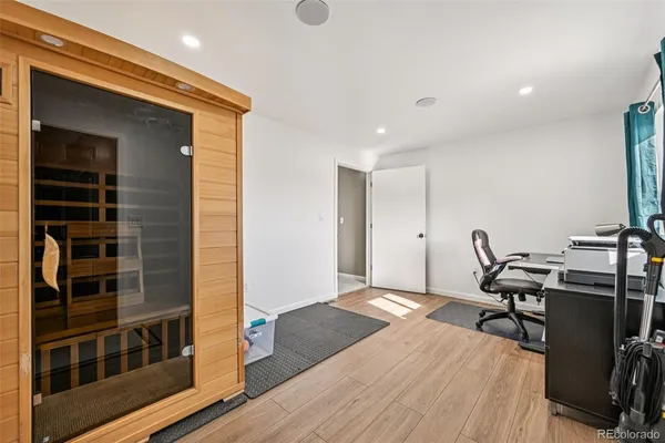 a bedroom with a bed and a dresser