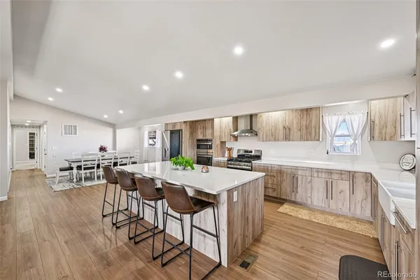 a view of a kitchen and dining room