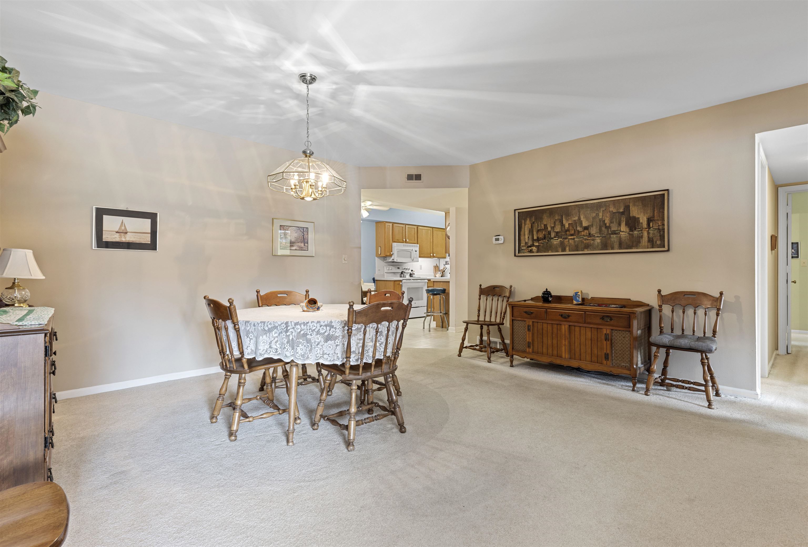 5548 Spring Brook Road Rockford, IL 61114 - Photo 3 of 24 a view of a dining room with furniture and chandelier