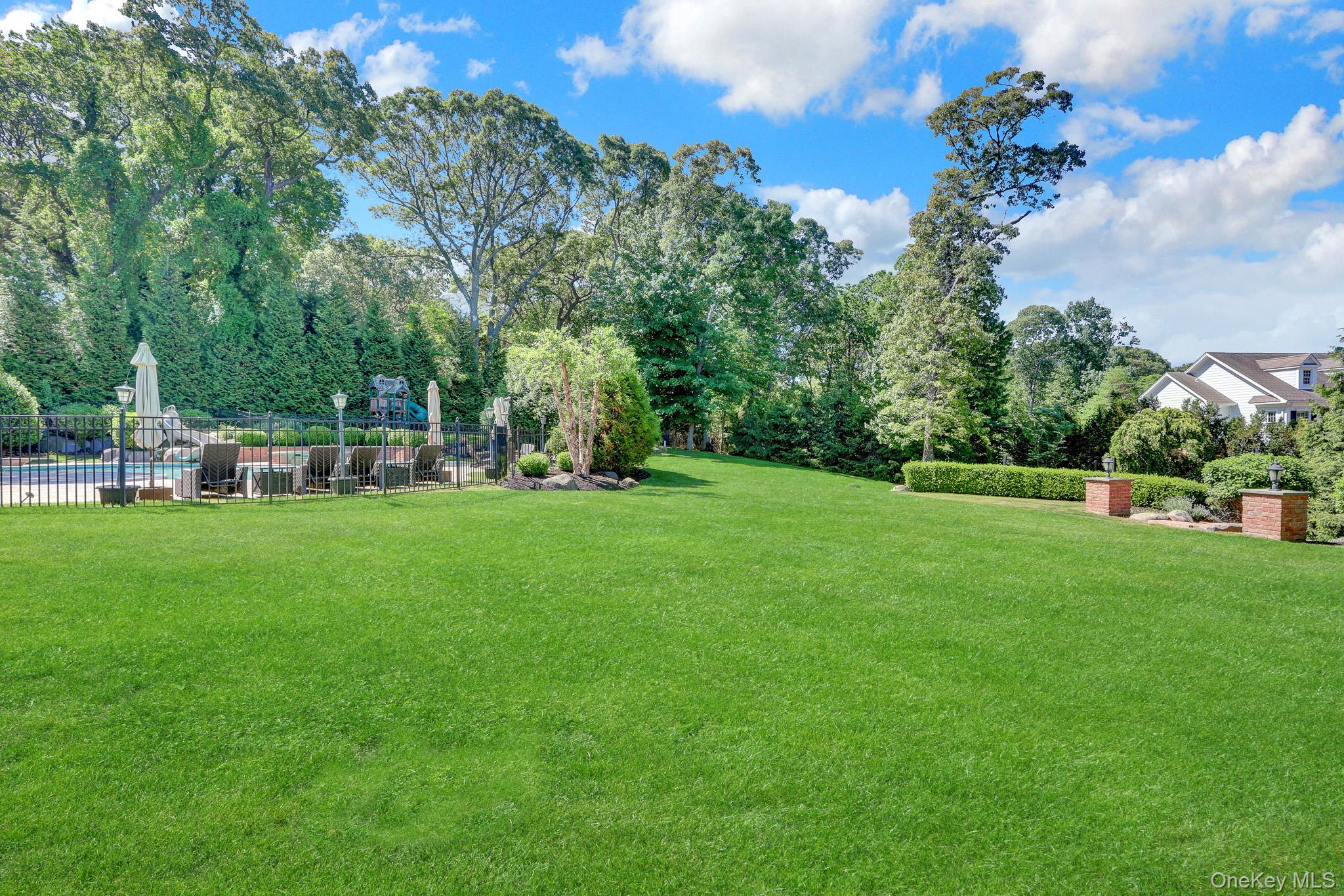 36 Old Field Road Setauket, NY 11733 - Photo 11 of 42 a view of yard with grass and trees