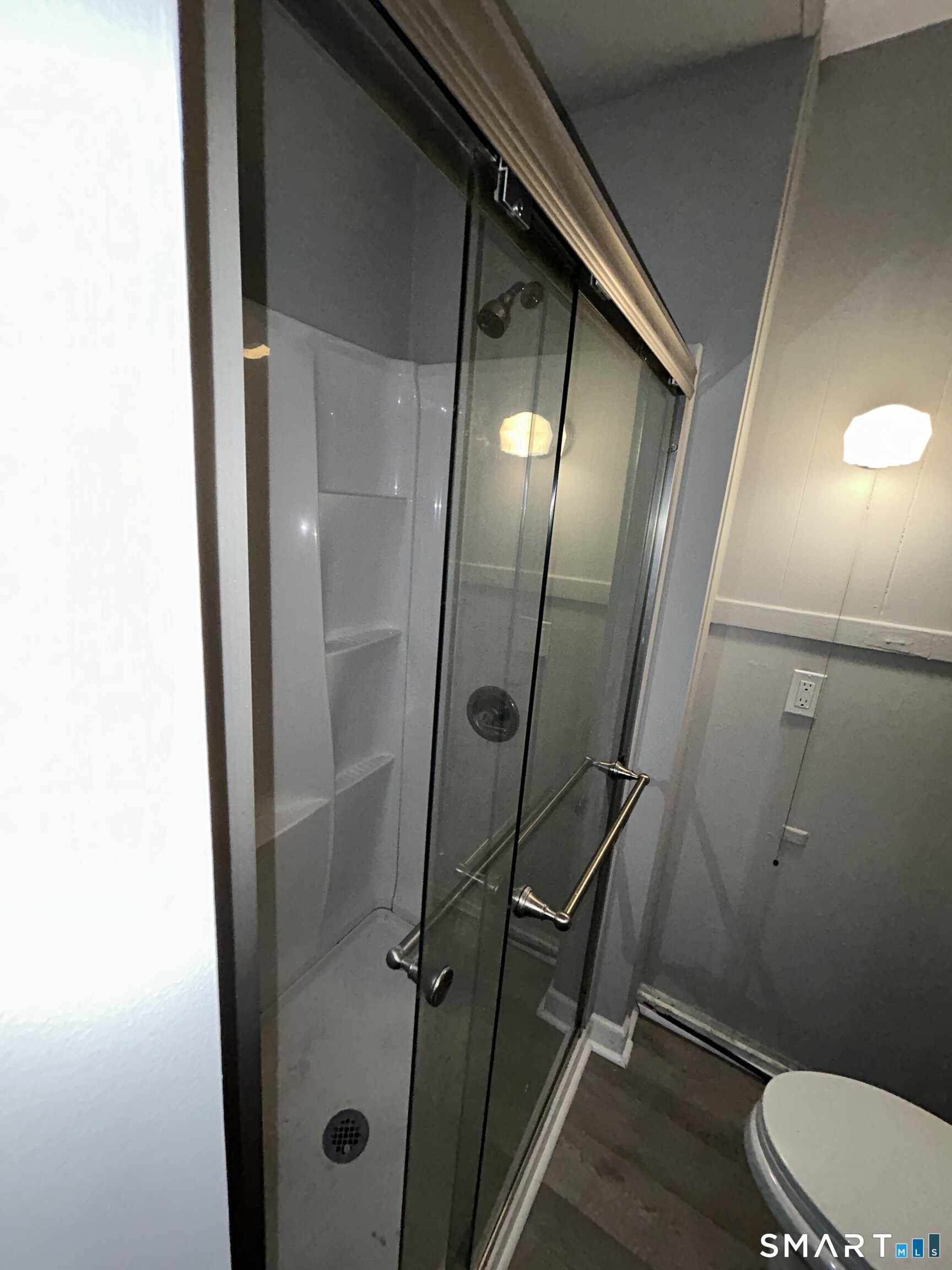 112 High Street Vernon, CT 06066 - Photo 1 of 1 a bathroom with a mirror and a toilet