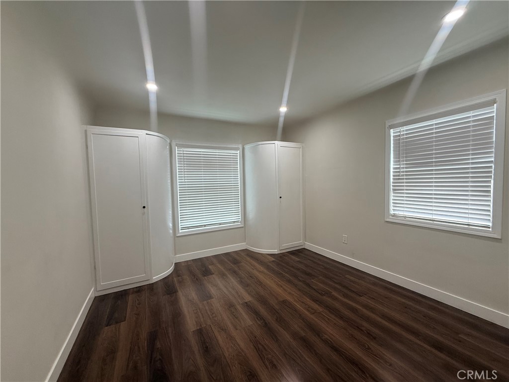 3688 Taft Street Riverside, CA 92503 - Photo 12 of 15 a view of an empty room with wooden floor and a window