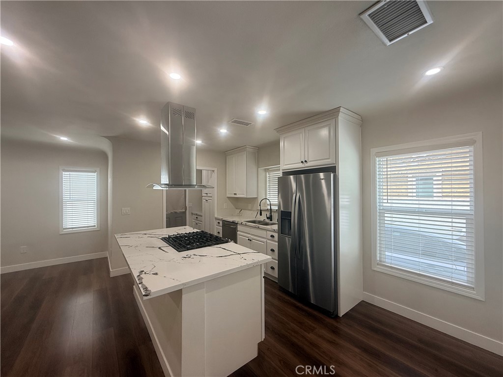3688 Taft Street Riverside, CA 92503 - Photo 5 of 15 a kitchen that has a refrigerator and a stove