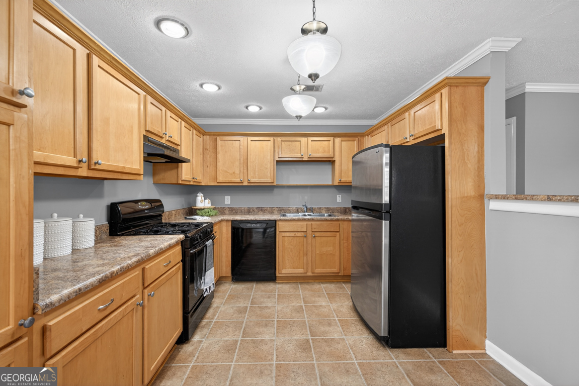 11 Johnston Road Griffin, GA 30224 - Photo 11 of 46 a kitchen with stainless steel appliances granite countertop a refrigerator and a stove top oven