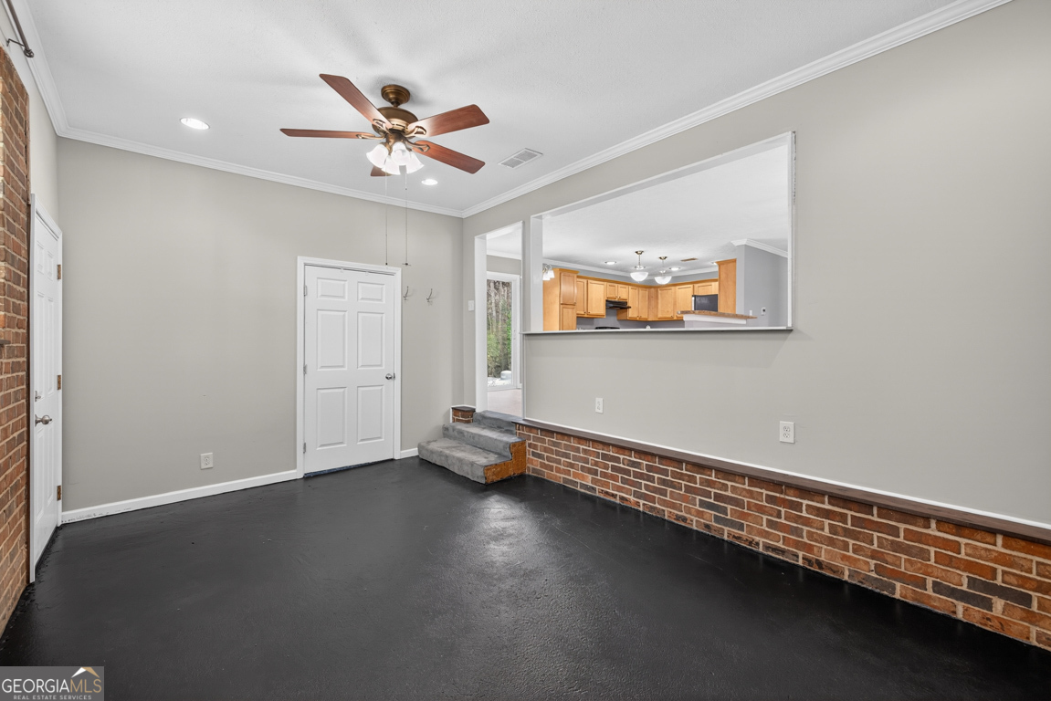 11 Johnston Road Griffin, GA 30224 - Photo 15 of 46 an empty room with a ceiling fan and window
