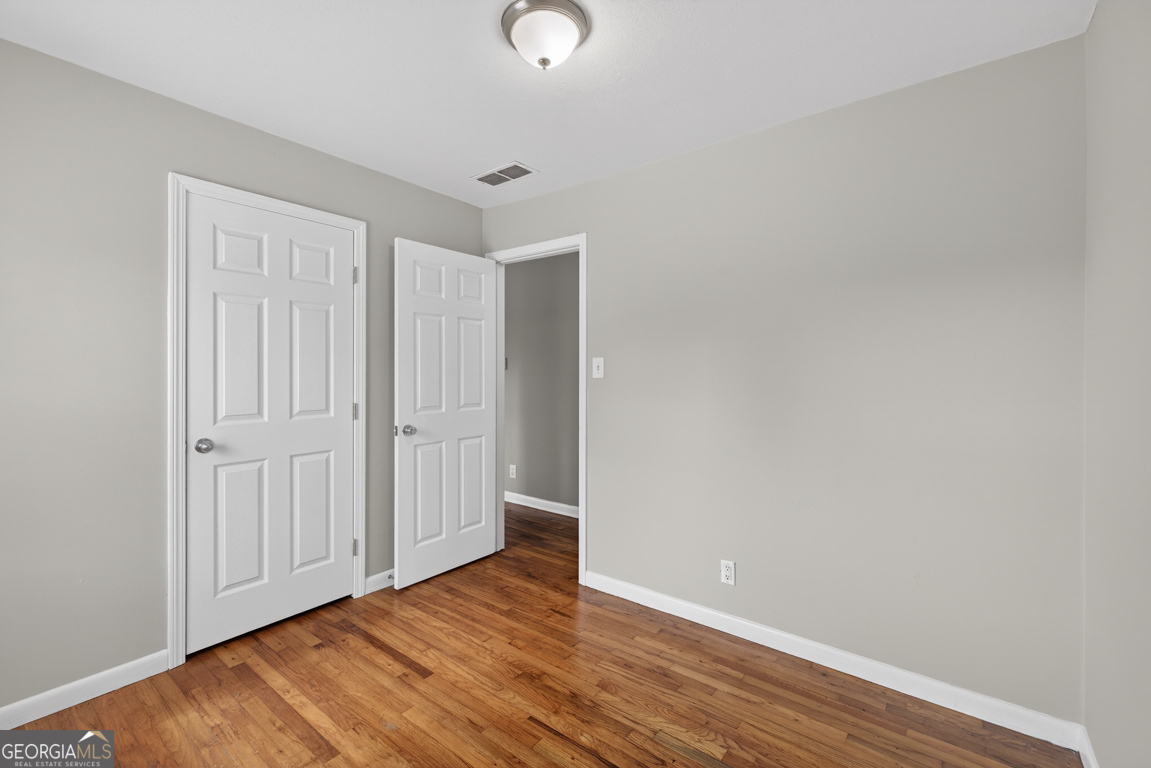 11 Johnston Road Griffin, GA 30224 - Photo 20 of 46 a view of an empty room with wooden floor