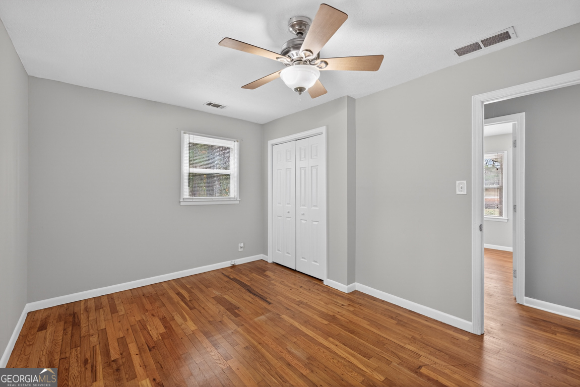 11 Johnston Road Griffin, GA 30224 - Photo 21 of 46 a view of empty room with wooden floor