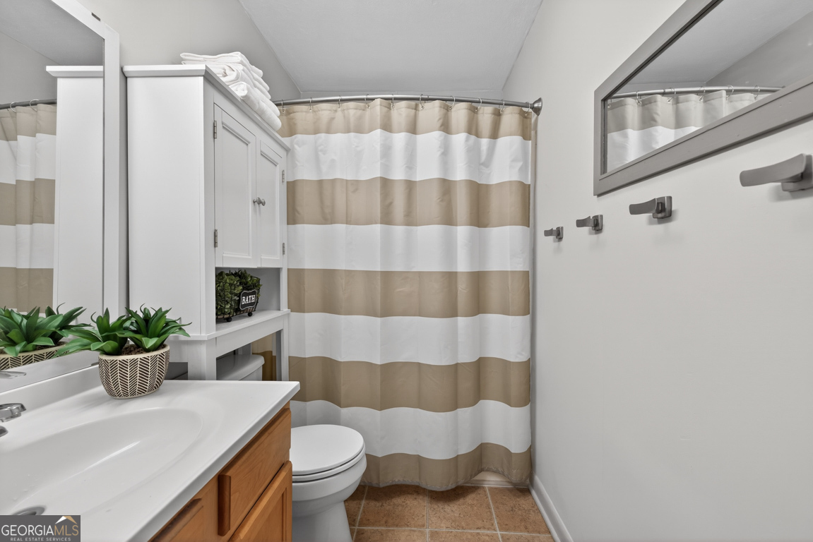 11 Johnston Road Griffin, GA 30224 - Photo 23 of 46 a bathroom with a sink toilet and shower