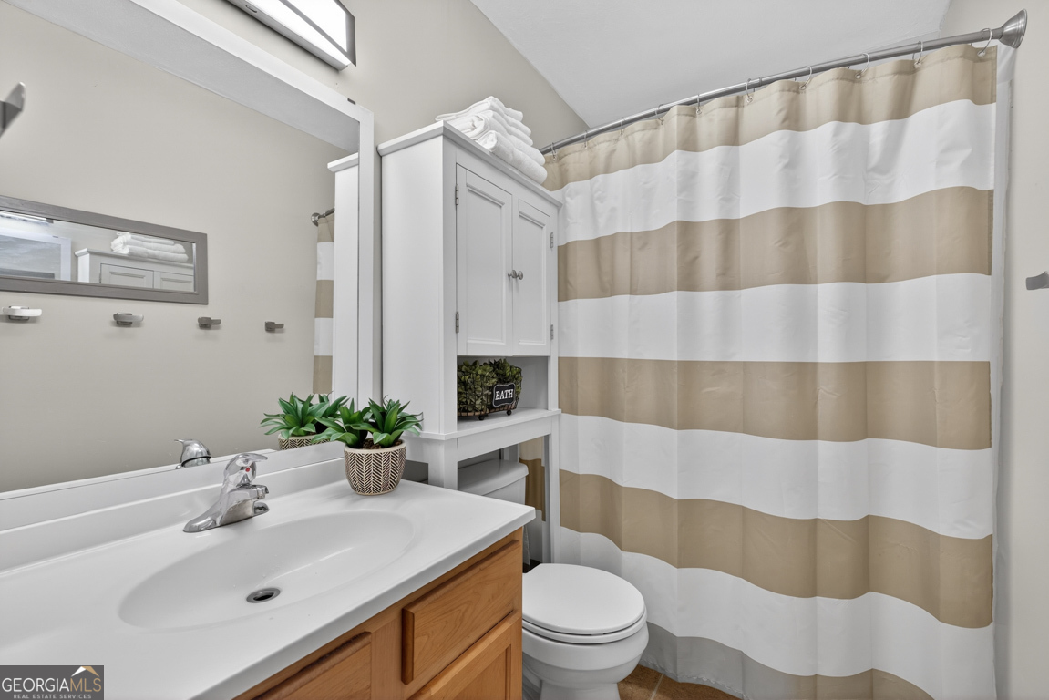 11 Johnston Road Griffin, GA 30224 - Photo 24 of 46 a bathroom with a sink and a mirror