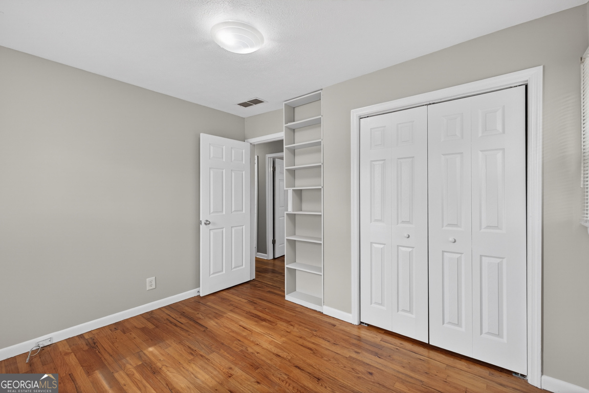 11 Johnston Road Griffin, GA 30224 - Photo 25 of 46 a view of an empty room with wooden floor